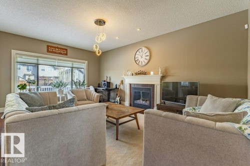 11408 15 Avenue Sw, Edmonton, AB - Indoor Photo Showing Living Room With Fireplace