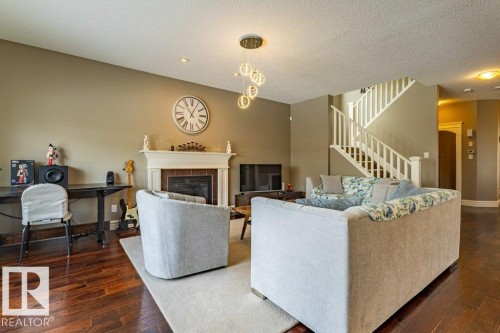 11408 15 Avenue Sw, Edmonton, AB - Indoor Photo Showing Living Room With Fireplace