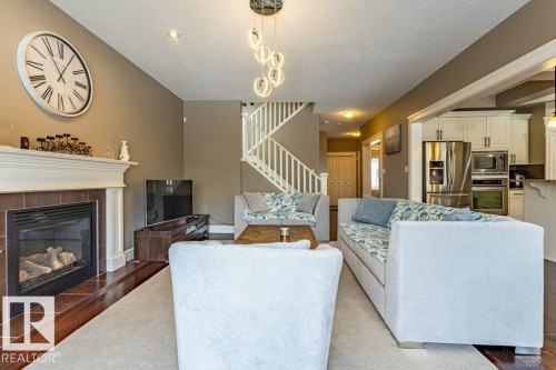 11408 15 Avenue Sw, Edmonton, AB - Indoor Photo Showing Living Room With Fireplace