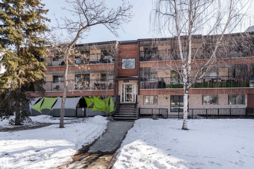 The property features a multi-story exterior with balconies on the upper levels - 2 10737 116 Street, Edmonton, AB - Outdoor