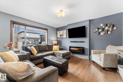 4 Hewitt Circle, Spruce Grove, AB - Indoor Photo Showing Living Room With Fireplace