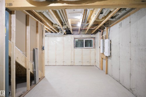Unfinished basement with stairs - 53 7110 Keswick Common Sw, Edmonton, AB - Indoor Photo Showing Basement