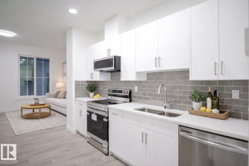 53 7110 Keswick Common Sw, Edmonton, AB - Indoor Photo Showing Kitchen With Stainless Steel Kitchen With Double Sink With Upgraded Kitchen