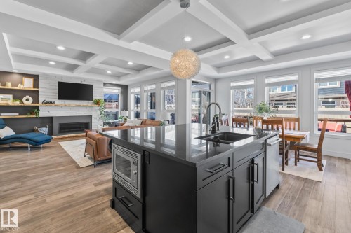 25 Enchanted Way, St. Albert, AB - Indoor Photo Showing Kitchen With Fireplace With Double Sink With Upgraded Kitchen