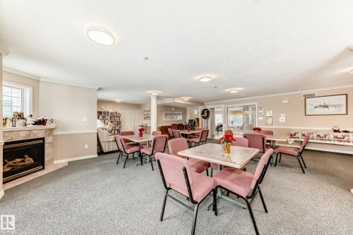 304 17150 94A Avenue, Edmonton, AB - Indoor Photo Showing Other Room With Fireplace