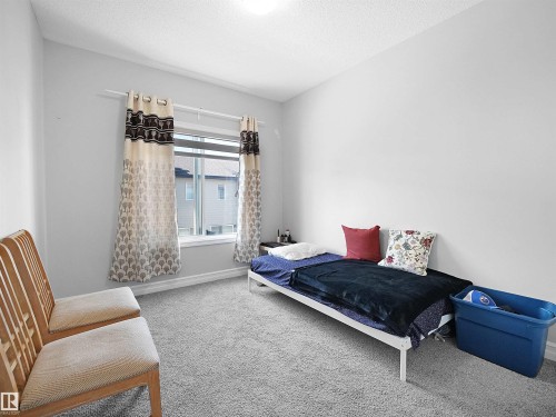 This room features light-colored walls and grey carpeting - 138 804 Welsh Drive, Edmonton, AB - Indoor