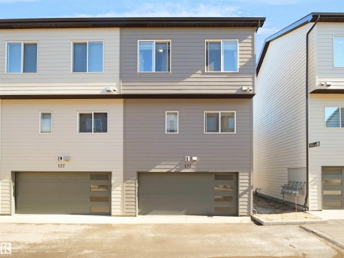 The property features a modern exterior with horizontal siding in varying shades - 138 804 Welsh Drive, Edmonton, AB - Outdoor