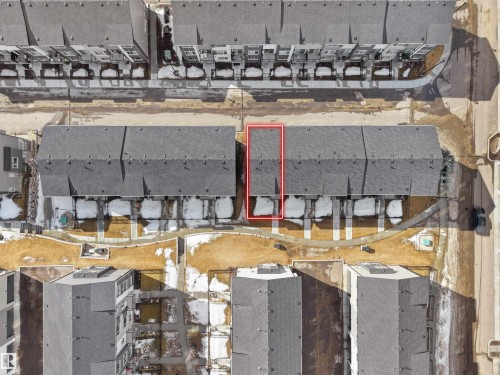 This property features a dark gray shingle roof and a private fenced yard space - 138 804 Welsh Drive, Edmonton, AB - Outdoor With View