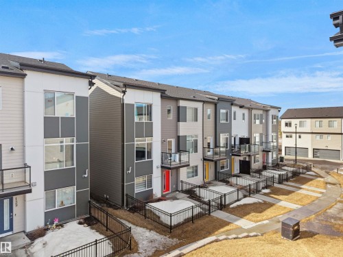 The property features a contemporary architectural style with varied facade finishes and balconies - 138 804 Welsh Drive, Edmonton, AB - Outdoor With Exterior