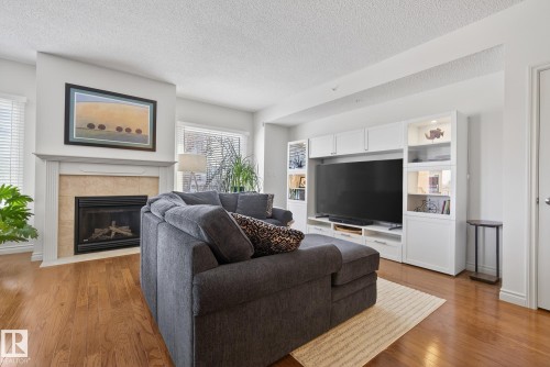 307 10108 125 Street, Edmonton, AB - Indoor Photo Showing Living Room With Fireplace