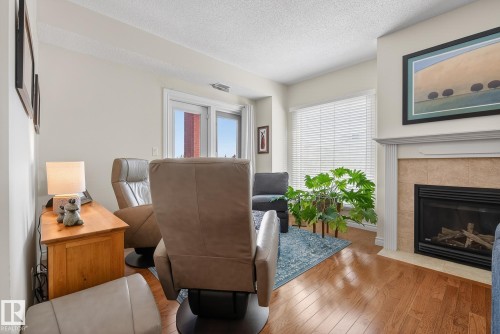 307 10108 125 Street, Edmonton, AB - Indoor Photo Showing Living Room With Fireplace