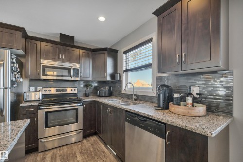 4 5203 149 Avenue, Edmonton, AB - Indoor Photo Showing Kitchen With Stainless Steel Kitchen With Double Sink With Upgraded Kitchen