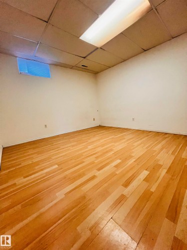 The room features light-toned wood flooring and recessed lighting - 11459 51 Avenue, Edmonton, AB - Indoor Photo Showing Other Room