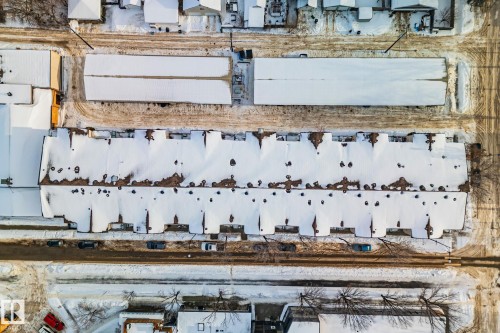 Aerial view showcasing the property's roofline, with visible street access and surrounding buildings - 116 11033 127 Street, Edmonton, AB -  With View