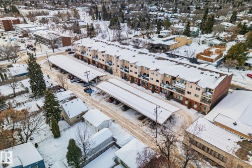 Aerial view of the property, showcasing its multi-story design and carports - 116 11033 127 Street, Edmonton, AB - Outdoor With View