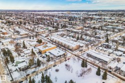 Aerial perspective showcasing the community's residential properties, roads, and trees - 