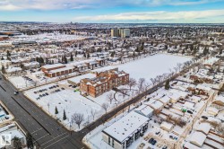 The property is set within a residential neighborhood featuring established trees, nearby park space, and a well-maintained street - 
