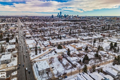 The property is located in a community with an extensive road network and a downtown skyline visible in the distance - 116 11033 127 Street, Edmonton, AB - Outdoor With View