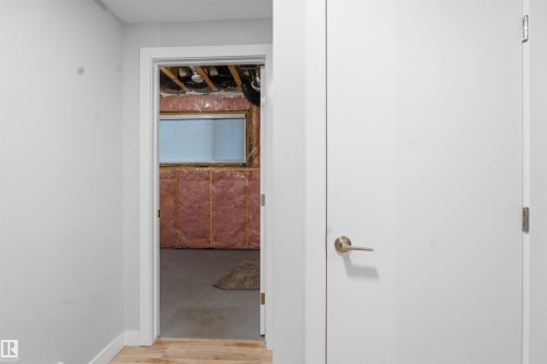 View of an unfinished basement space with exposed insulation, a window, and concrete flooring - 40 1729 Keene Crescent, Edmonton, AB - Indoor Photo Showing Other Room