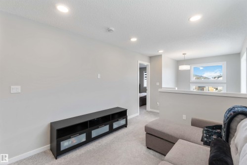 This property features light gray walls, recessed lighting, and light colored carpeting - 29 Gambel Loop, Spruce Grove, AB - Indoor