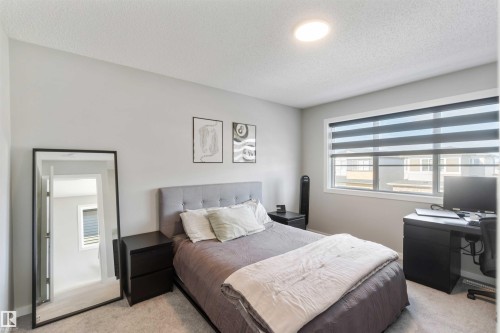 Bedroom featuring light gray walls, a window with horizontal blinds, and carpeted flooring - 29 Gambel Loop, Spruce Grove, AB - Indoor Photo Showing Bedroom
