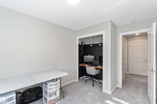 The property features neutral-toned walls and grey carpeting, creating a versatile interior - 29 Gambel Loop, Spruce Grove, AB - Indoor