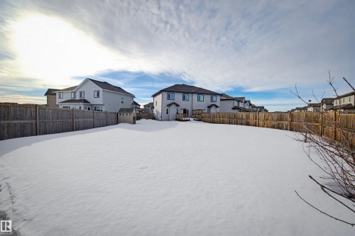 The property features an extensive fenced yard with a storage shed - 2812 16 Avenue, Edmonton, AB - Outdoor