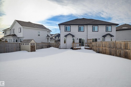 The property features a spacious backyard with a wooden fence and a storage shed - 2812 16 Avenue, Edmonton, AB - Outdoor