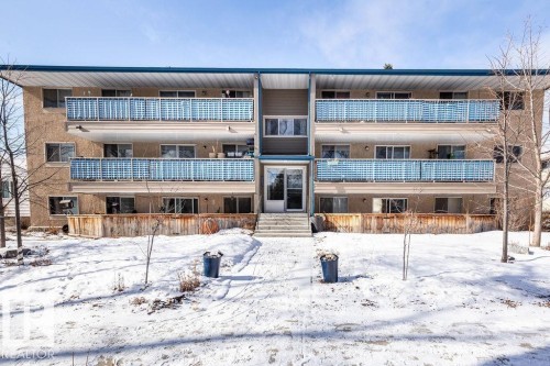 The property features a multi-story exterior with balconies on the upper levels - 4 10836 116 Street, Edmonton, AB - Outdoor