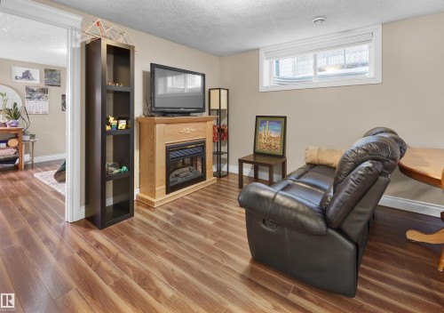 11567 80 Avenue, Edmonton, AB - Indoor Photo Showing Living Room With Fireplace