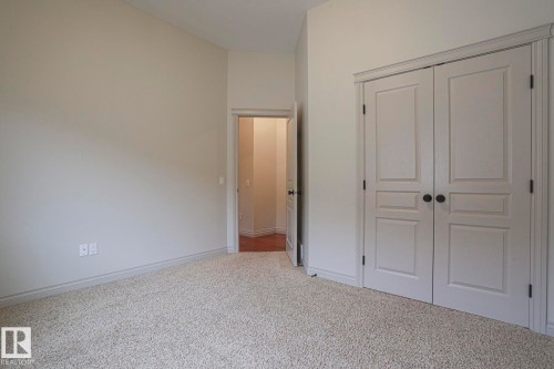 With Laundry in closet - 21 Willow Way, Stony Plain, AB - Indoor Photo Showing Other Room