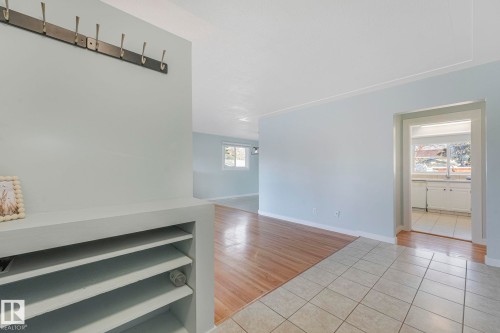 The property features a entryway with tile flooring and a built-in storage unit - 15704 91 Avenue, Edmonton, AB - Indoor Photo Showing Other Room
