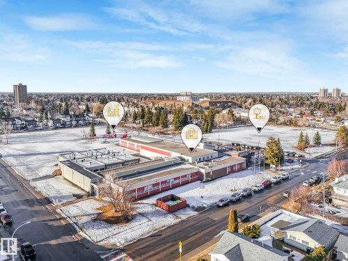 The property is located in a community featuring various buildings, including multi-story structures and single-story residences - 15704 91 Avenue, Edmonton, AB - Outdoor With View