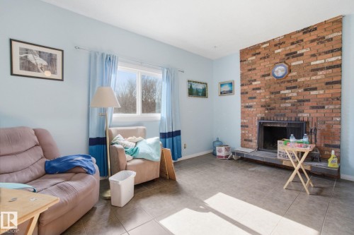 Sunken Family Room with fire place - 82 Windermere Drive, Spruce Grove, AB - Indoor Photo Showing Living Room With Fireplace