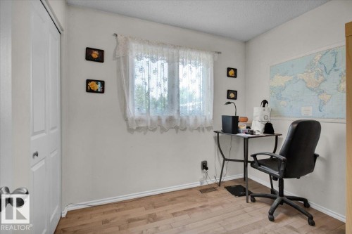 The room features light-colored walls and wood-look flooring - 3523 18A Avenue, Edmonton, AB - Indoor Photo Showing Office