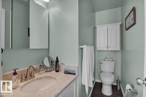 Bathroom featuring a vanity with a light-colored countertop, an oval undermount sink, and a wall-mounted medicine cabinet - 3523 18A Avenue, Edmonton, AB - Indoor Photo Showing Bathroom