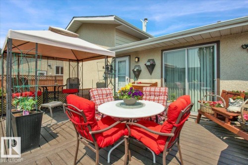 The property features a spacious wooden deck with a gazebo, providing an inviting outdoor living area - 3523 18A Avenue, Edmonton, AB - Outdoor With Deck Patio Veranda With Exterior