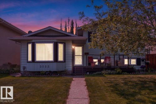 The property features a front lawn and a walkway leading to the entrance - 3523 18A Avenue, Edmonton, AB - Outdoor