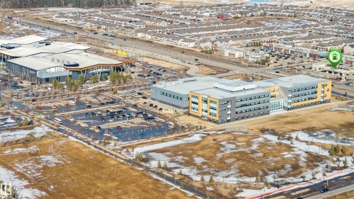 Aerial view showcasing the property's surrounding area, featuring commercial buildings and residential developments - 2244 21 Avenue, Edmonton, AB - Outdoor With View