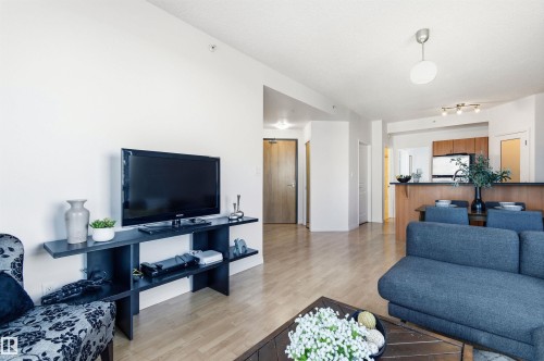 Open concept living space featuring light-toned flooring, white walls, and recessed lighting - 601 10504 99 Avenue, Edmonton, AB - Indoor Photo Showing Living Room