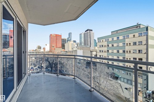 Balcony with a glass railing system and a cityscape view - 601 10504 99 Avenue, Edmonton, AB - Outdoor With Balcony