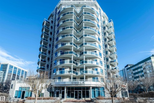 The property is a modern high-rise building with numerous private balconies featuring glass railings - 601 10504 99 Avenue, Edmonton, AB - Outdoor With Balcony With Facade