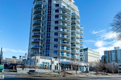 The property is a high-rise building featuring numerous curved balconies with glass railings - 601 10504 99 Avenue, Edmonton, AB - Outdoor With Balcony With Facade