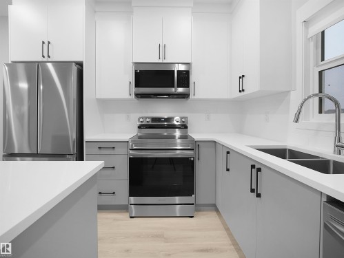3272 Dallas Schmidt Drive, Edmonton, AB - Indoor Photo Showing Kitchen With Double Sink