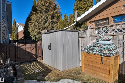 The property includes a fenced dog run on the side of the house. - 8807 31 Avenue, Edmonton, AB - Outdoor