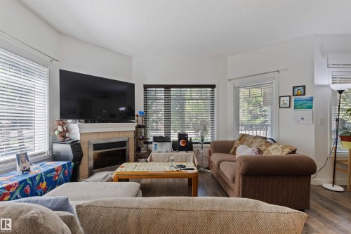 101 8931 156 Street, Edmonton, AB - Indoor Photo Showing Living Room With Fireplace