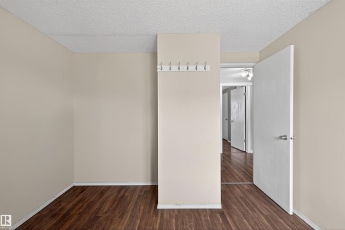 The property features wood-style flooring and light-colored walls - 3301 139 Avenue, Edmonton, AB - Indoor Photo Showing Other Room