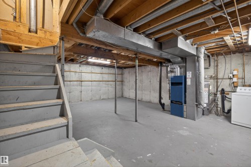 The property features an unfinished basement with concrete walls and flooring, exposed ceiling joists, and a utility area with mechanical equipment - 3301 139 Avenue, Edmonton, AB - Indoor