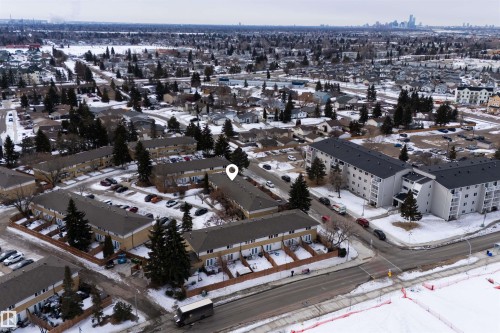 The property features multi-unit buildings with dark roofs and light-colored facades - 3301 139 Avenue, Edmonton, AB - Outdoor With View
