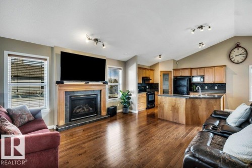 253 Birchwood Drive, Devon, AB - Indoor Photo Showing Living Room With Fireplace